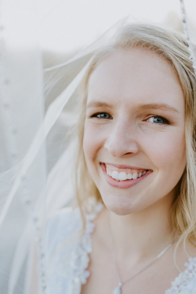 A bride smiles radiantly.